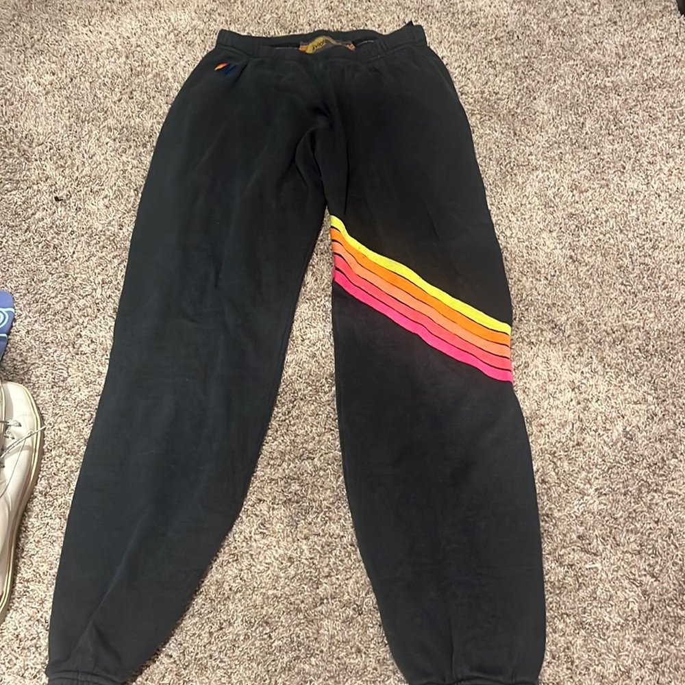 AVIATOR NATION SWEATPANTS. NAVY BLUE W NEON STRIPES